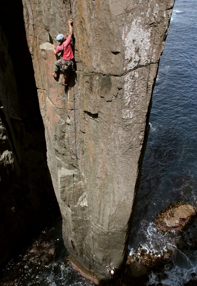 Erik Carleberg, of Sweden, nearing the top of The Totem Pole's first pitch variation, 24, and thankful for not dropping any bolt plates into the ocean.
