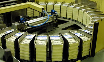 Freshly printed dollar bills in Washington, DC.